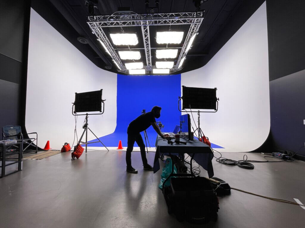 Tucson production studio setting up blue screen for filming